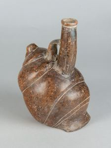 Image of molded pottery, shell form vessel