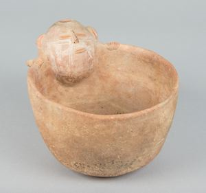 Image of molded pottery bowl with incised human head